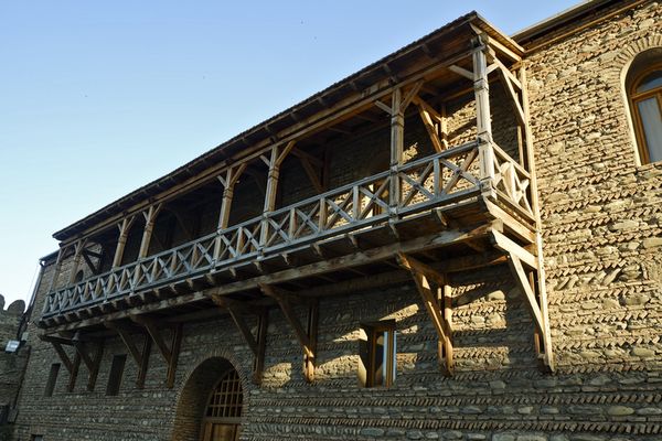 Traditional Georgian wooden balcony inside the complex