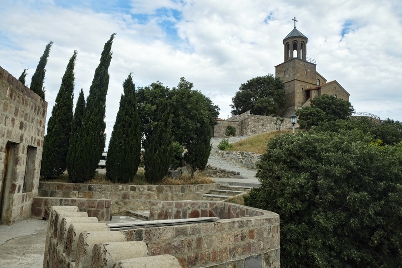 View of Kojori church with cypresses