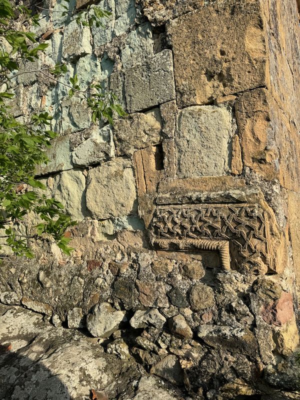 Carvings on ancient stones of the fortress wall