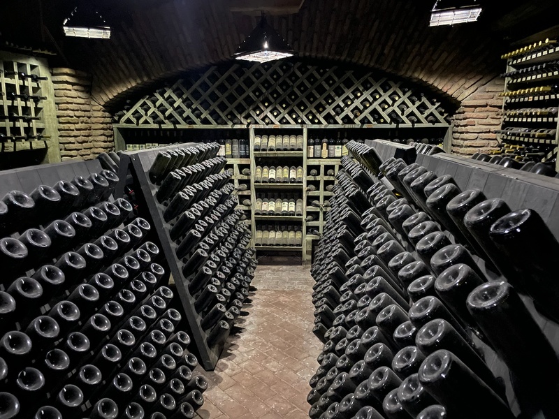 Thousands of bottles in a vaulted cellar
